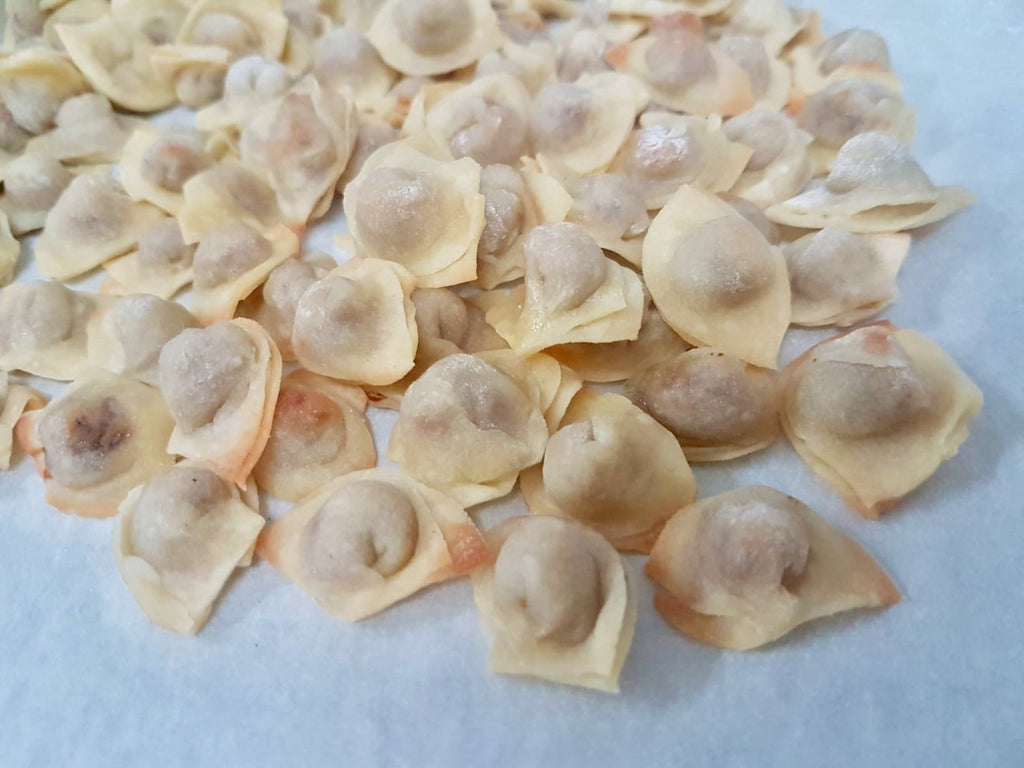 Now we bake our manti so it wont stick when shipped