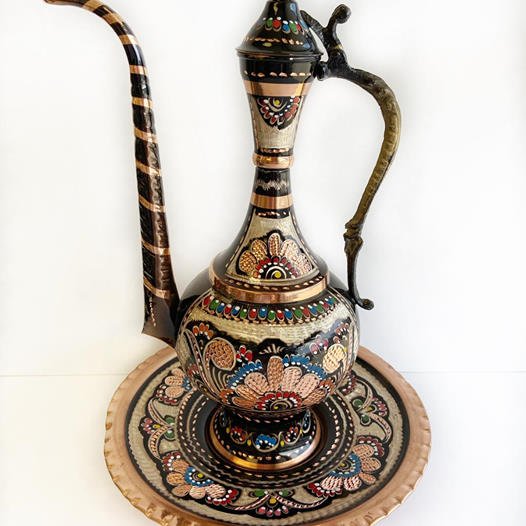 Ornated urn for ceremonial hand wash